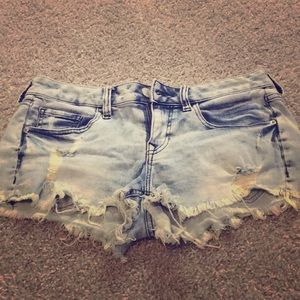 Light wash distressed jean shorts